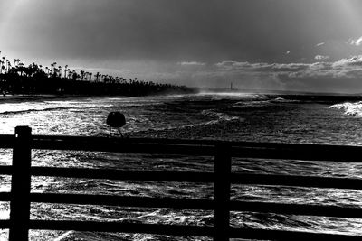 Scenic view of sea against cloudy sky