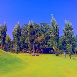 Scenic view of landscape against clear blue sky