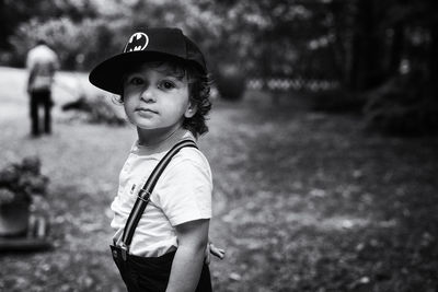 Portrait of boy wearing hat standing outdoors