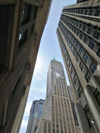 Low angle view of skyscrapers against sky