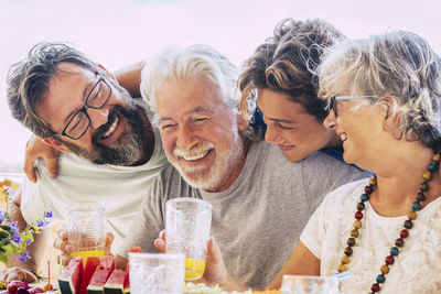 Portrait of smiling friends having drink