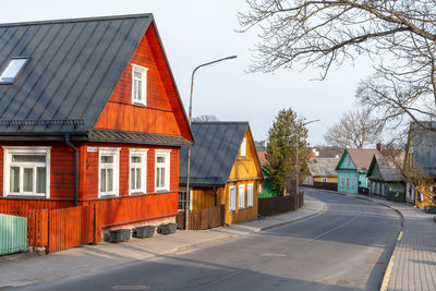 Old lithuanian traditional green wooden houses with three windows in trakai, vilnius district