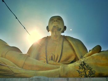 Low angle view of statue against sky