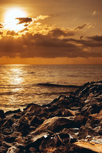 Scenic view of sea against sky during sunset