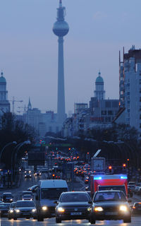 Traffic on city street with buildings in background