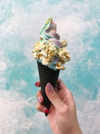 Close-up of hand holding ice cream