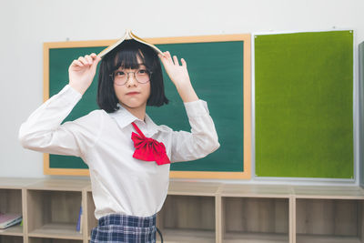 Full length of girl standing at home