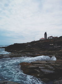 Scenic view of sea against cloudy sky