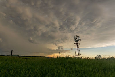 Nebraska windmill with mammatus clouds at sunset