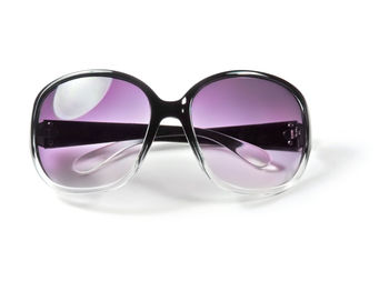 Close-up of sunglasses against white background