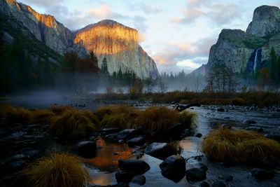 Scenic view of lake against rocky mountains