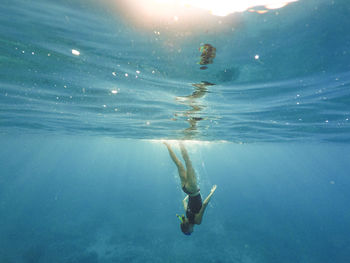 Woman swimming in sea