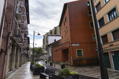 Narrow alley amidst buildings in city