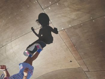 High angle view of girl skateboarding