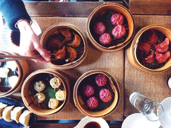 Cropped image of hand holding food