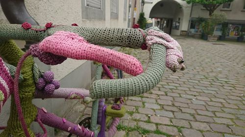 Close-up of multi colored umbrellas on street