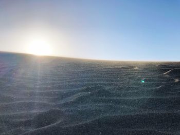 Scenic view of sun shining on sunny day