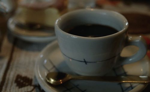 Close-up of coffee cup on table