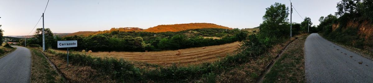Panoramic view of empty road against sky