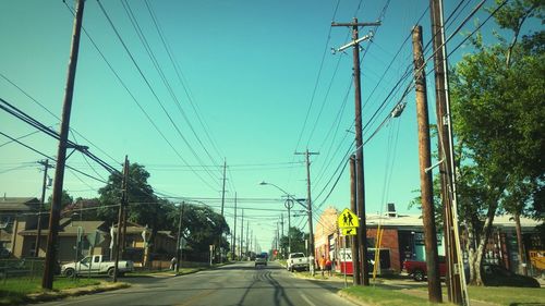 Electricity pylon against blue sky