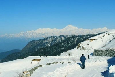 Scenic view of snow covered mountains