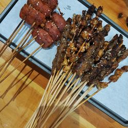 High angle view of meat on barbecue grill