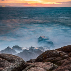 Scenic view of sea against sky during sunset