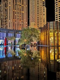 Modern buildings in city at night