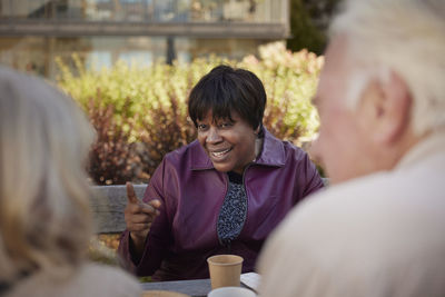 People having coffee together