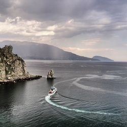 Scenic view of sea against cloudy sky