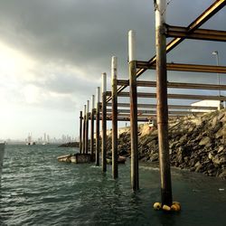 Pier on sea against sky