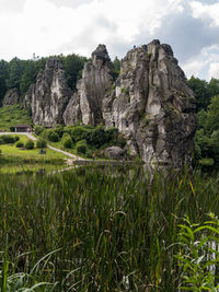 Scenic view of rocks on field against sky