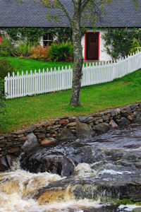 View of stone wall by building