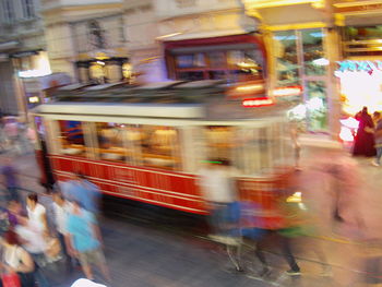 Blurred motion of woman at night