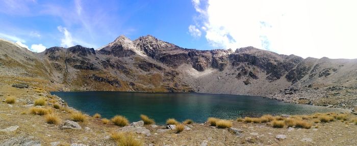 Panoramic view of lake and mountains against sky