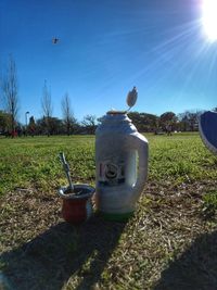 View of trees on field against clear sky