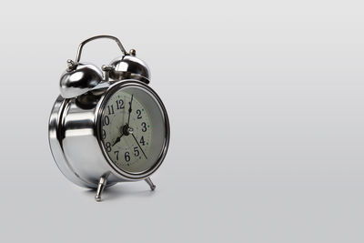 Close-up of clock against white background