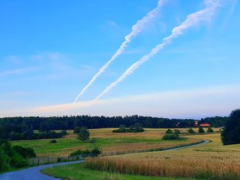 Scenic view of rural landscape against sky