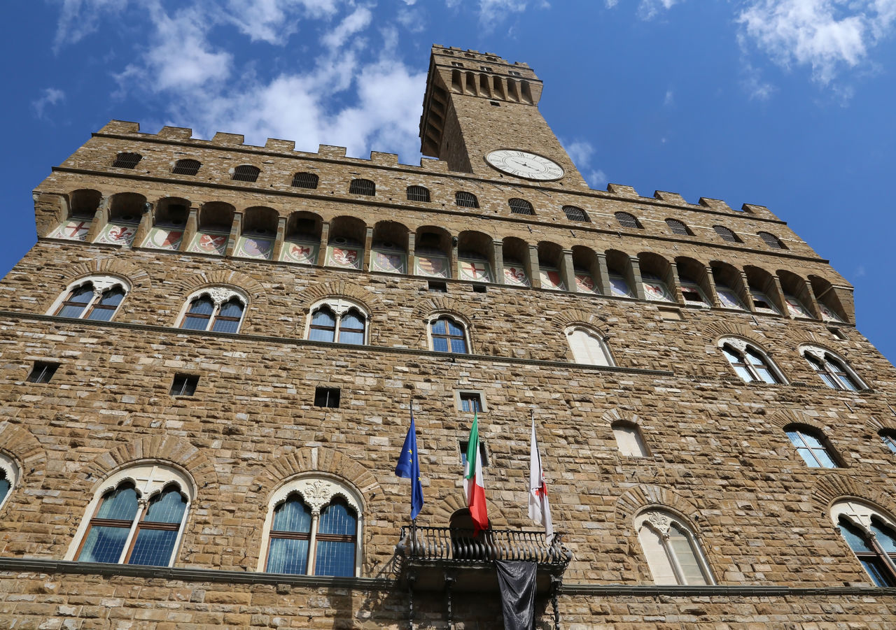 LOW ANGLE VIEW OF HISTORIC BUILDING AGAINST BLUE SKY