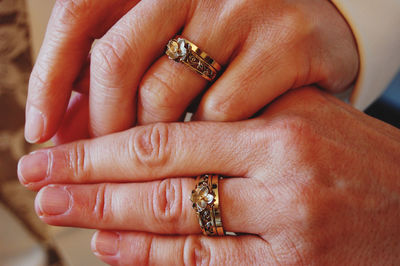 Close-up of couple holding hands