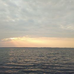 Scenic view of sea against sky at sunset