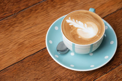 High angle view of cappuccino on table