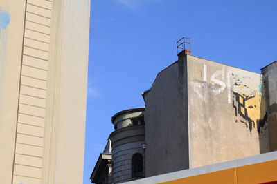 Low angle view of building against blue sky