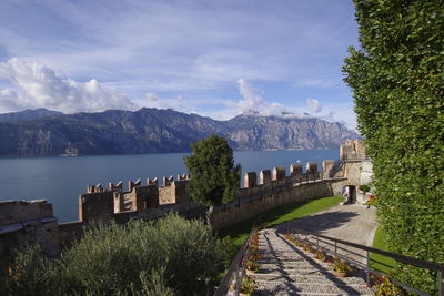 Panoramic view of sea and mountains against sky
