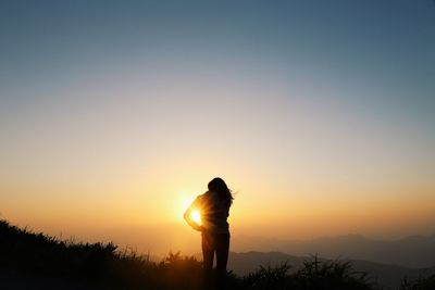 Scenic view of landscape at sunset