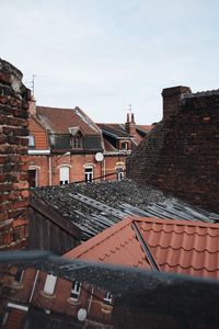 Houses against sky in city