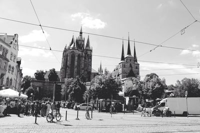 Buildings against cloudy sky