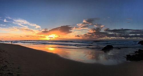 Scenic view of sea against sky at sunset