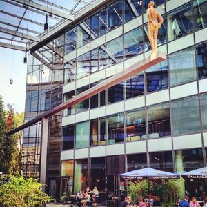 Low angle view of modern glass building in city