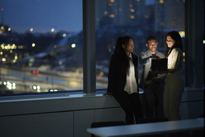 Colleagues working late in office